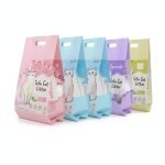 A large, heavy-duty **cat litter packaging bag** with a sturdy plastic handle, standing upright.
