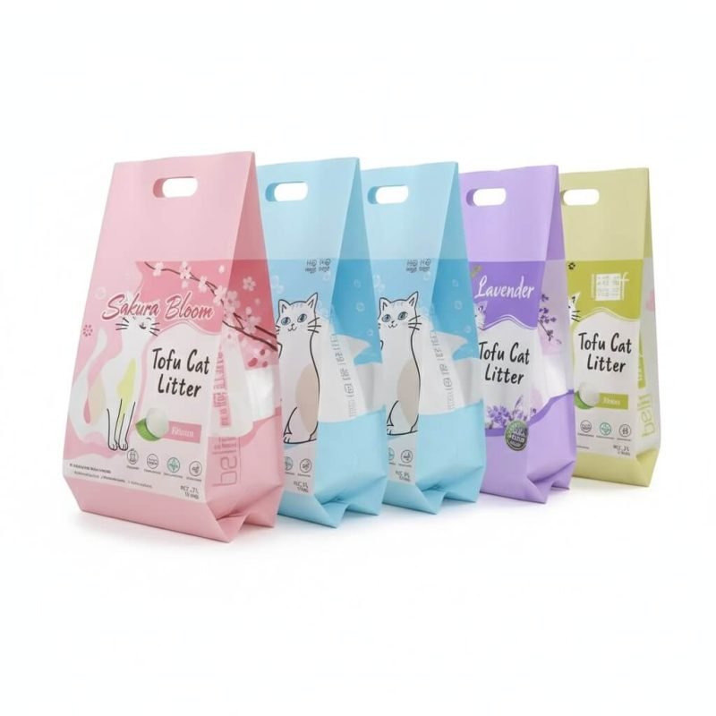 A large, heavy-duty **cat litter packaging bag** with a sturdy plastic handle, standing upright.