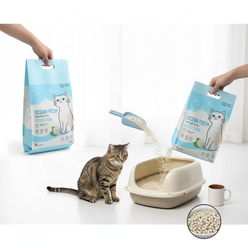 A large, heavy-duty **cat litter packaging bag** with a sturdy plastic handle, standing upright.