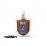 A custom printed frosted **cold brew spout pouch** standing upright, filled with dark coffee concentrate.
