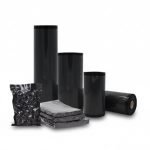 A premium **black vacuum sealer bags** pouch containing a fresh steak, showing the high-contrast black back and clear front.