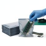 A translucent silver ESD shielding bag for electronics with a PCB visible inside.