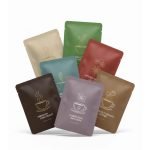A custom printed matte small sachet packing pouch with tear notch for hanging ear drip coffee.
