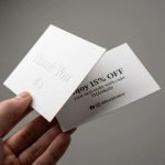 A group of personalized modern package insert cards with gold foil logos on a textured paper background.