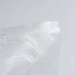 A clear recyclable vacuum sealer bag roll with an embossed texture showing a recyclable PE symbol.