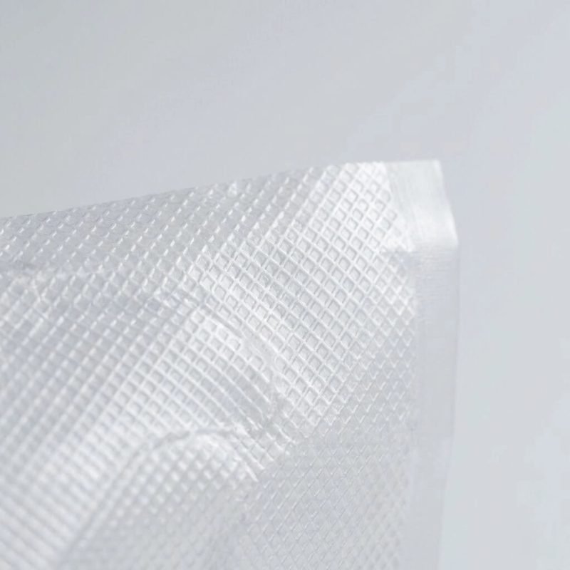 A clear recyclable vacuum sealer bag roll with an embossed texture showing a recyclable PE symbol.