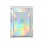 A shimmering holographic poly mailer reflecting a rainbow of colors with a boutique logo printed on it.
