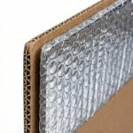 A high-quality insulated shipping box showing the reflective silver foil liner inside a brown corrugated carton.