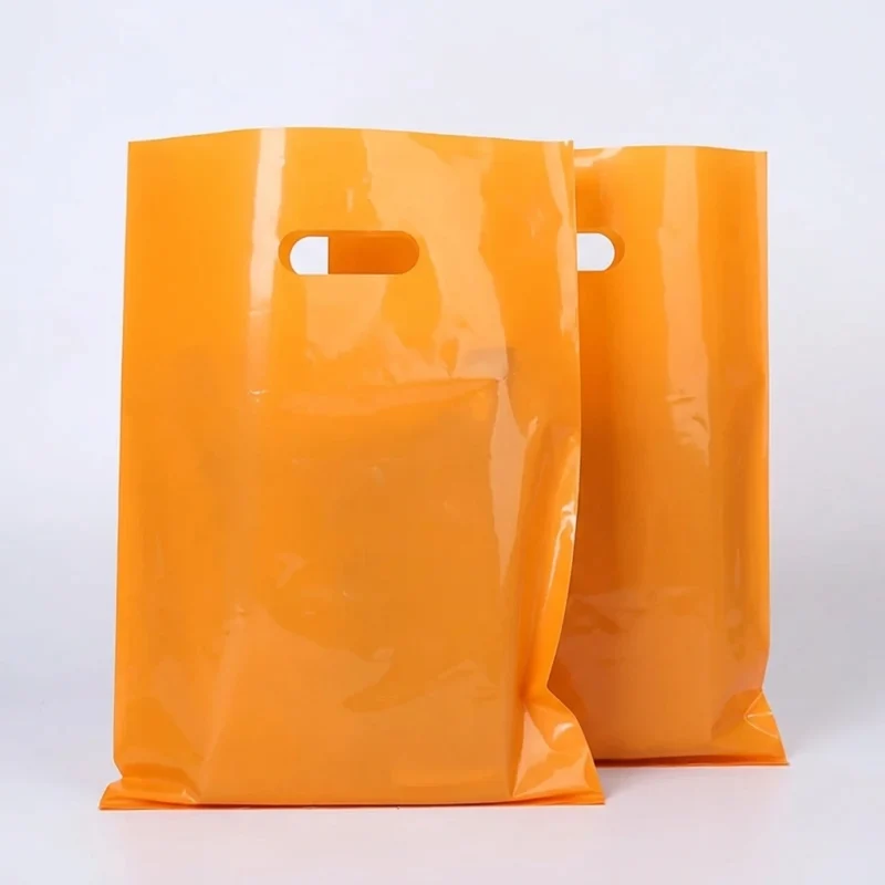 Soft die cut handle plastic bags material roll showing PET BOPP layer flexibility and durability
