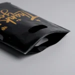 Industrial packaging of die cut handle plastic bags with custom width options for printing houses