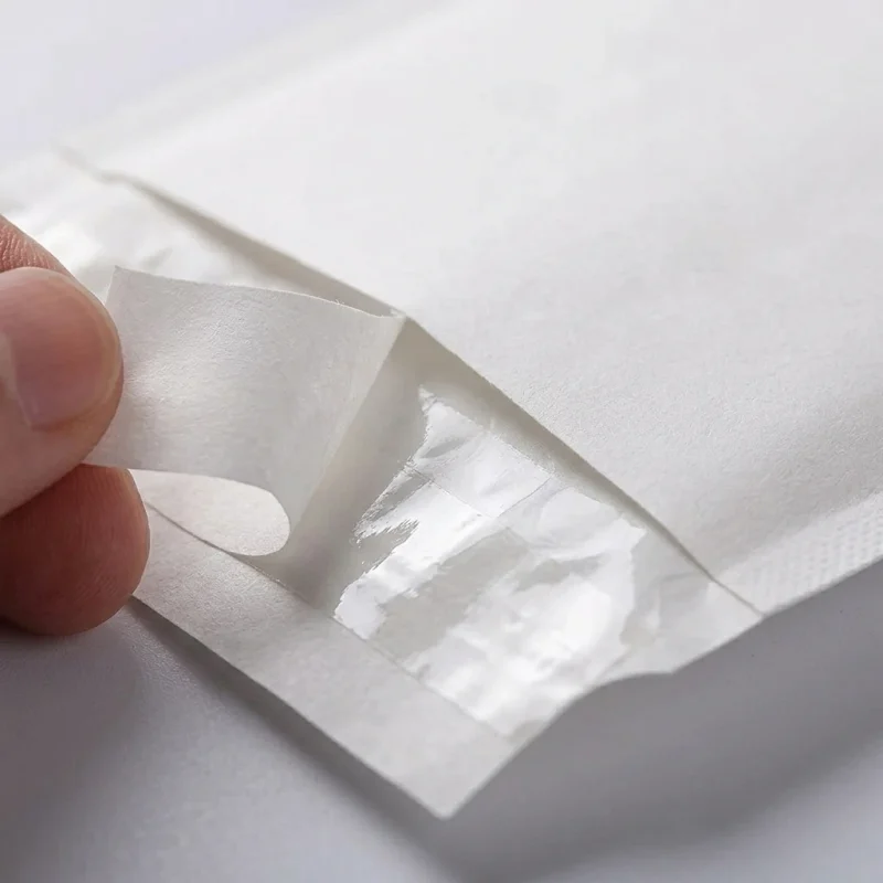 Soft biodegradable self adhesive mailing bags material roll showing PET BOPP layer flexibility and durability