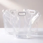stand up spout pouch with handle showing prismatic rainbow effect on transparent soft BOPP base
