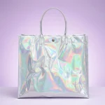 Close-up of holographic pvc tote bag surface with vertical holographic grating pattern