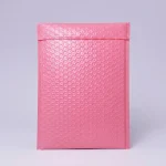 Close-up of heavy duty poly bubble mailers surface with vertical holographic grating pattern
