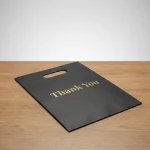 Die cut handle plastic bag applied on luxury gift packaging demonstrating 3D laser reflection