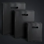 Industrial packaging of Die cut handle plastic bag with custom width options for printing houses