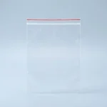 Close-up of clear PE zipper bag surface with vertical holographic grating pattern